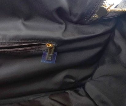 LOUIS VUITTON
Louis Vuitton rolling duffel...