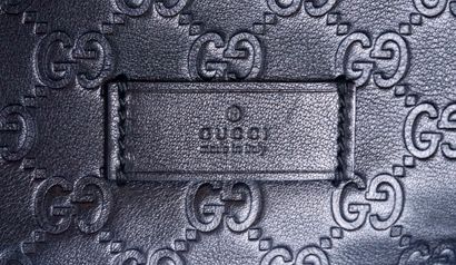 GUCCI
Large Gucci clutch in black Monogrammed...