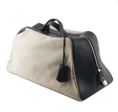HERMÈS 
Hermès travel bag in gray canvas...