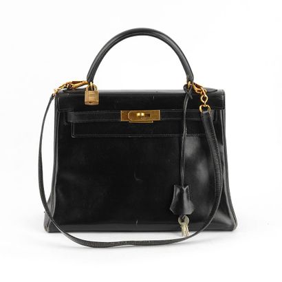 HERMÈS
Sac vintage Hermès Kelly en cuir noir,...