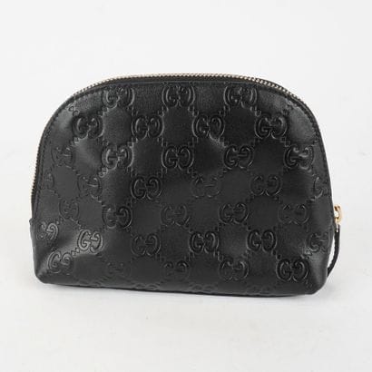 GUCCI
Petite pochette Gucci en cuir noir...