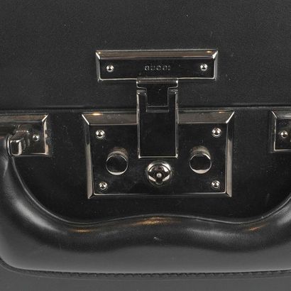 GUCCI
Malle vintage noire Gucci pour homme,...
