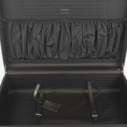 PRADA
Valise Prada en toile et cuir noir,...