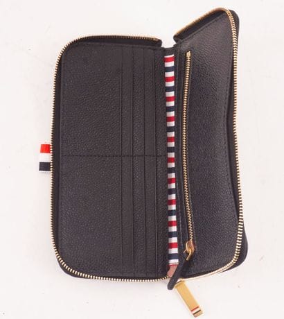 THOM BROWNE
Thom Browne black leather wallet...