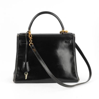 HERMÈS
Sac vintage Hermès Kelly en cuir noir,...