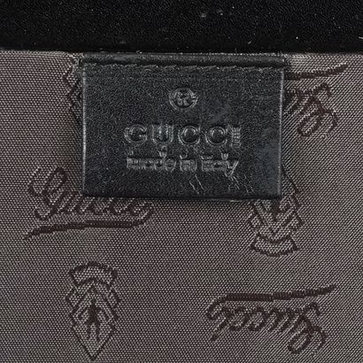 GUCCI
Malle vintage noire Gucci pour homme,...