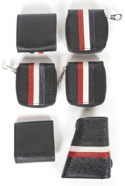 THOM BROWNE
5 petits porte-monnaie et un...