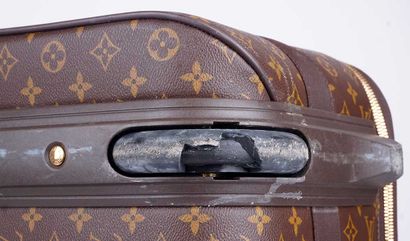 LOUIS VUITTON
Valise à roulettes Louis Vuitton...