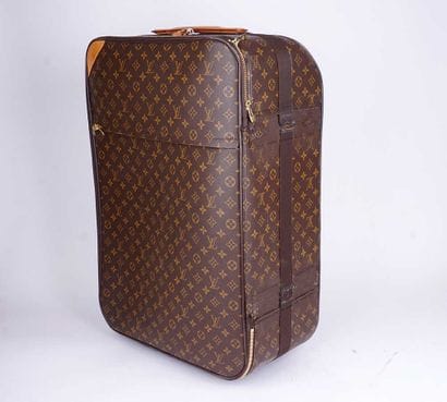 LOUIS VUITTON
Valise à roulettes Louis Vuitton...