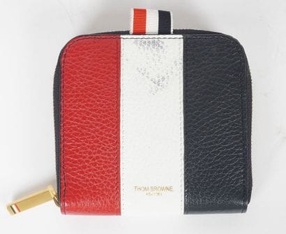 THOM BROWNE
Porte-monnaie en cuir rouge blanc...