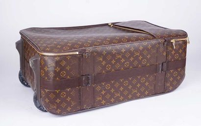 LOUIS VUITTON
Valise à roulettes Louis Vuitton...