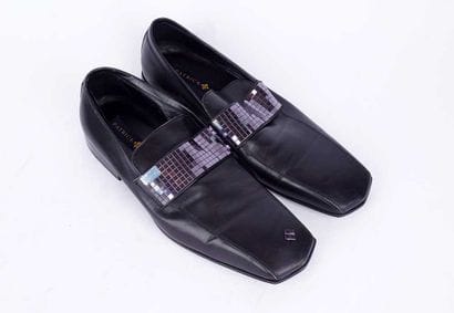 PATRICK COX
Paire de mocassins en cuir marron...