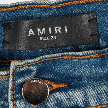 AMIRI 
Jean bleu coupe skinny en denim élastique....