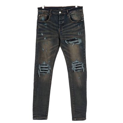 AMIRI
Jeans bleu foncé avec déchirures
Taille...