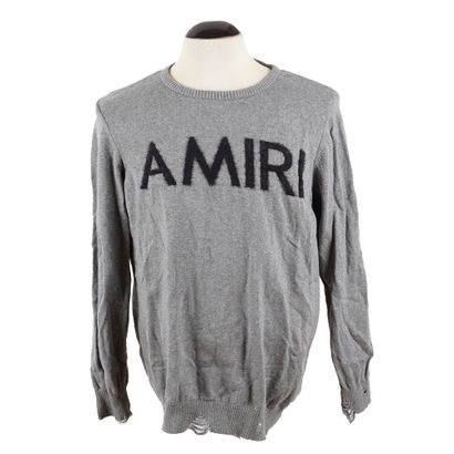 AMIRI
Pull gris avec logotype noir au devant...