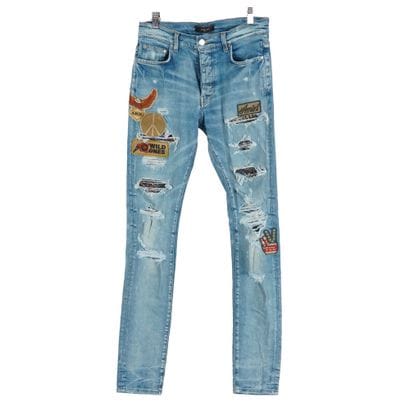 AMIRI 
Jean bleu coupe skinny en denim élastique....