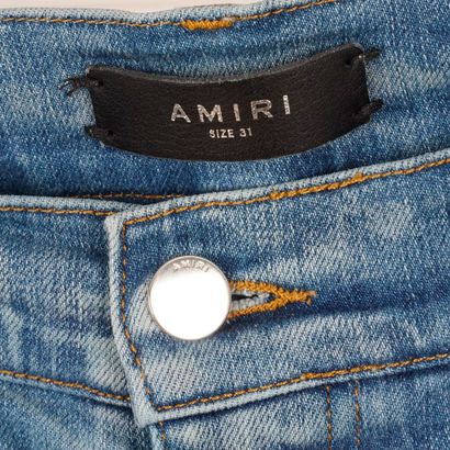 AMIRI 
Jean bleu coupe skinny en denim élastique....