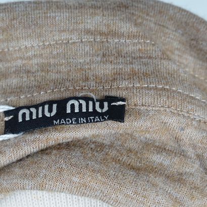 MIU MIU
A brown long-sleeved polo shirt.
Size...