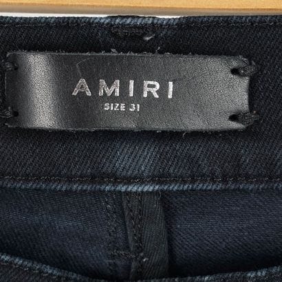 AMIRI
Jean noir coupe skinny en denim élastique....