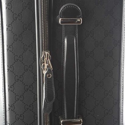 GUCCI
Gucci Monogram canvas rolling suitcase...