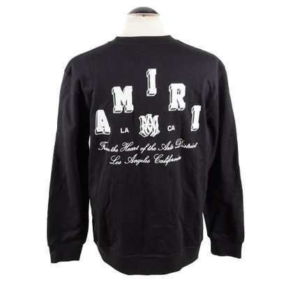 AMIRI 
Pull noir avec logotypes blancs au...