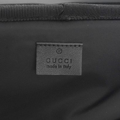GUCCI
Gucci Monogram canvas rolling suitcase...