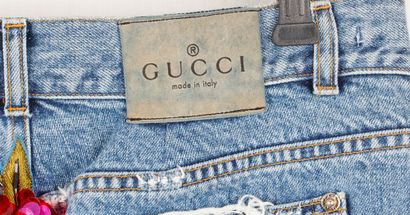 GUCCI
Gucci mid-length distressed denim skirt...