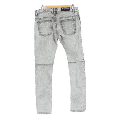 AMIRI
Jeans bleu foncé avec déchirures
Taille...