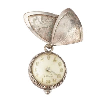 HUGUENIN
Ancienne montre broche Huguenin...