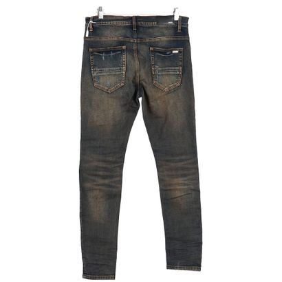 AMIRI
Jeans bleu foncé avec déchirures
Taille...