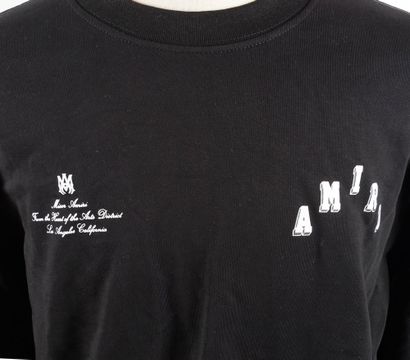 AMIRI 
Pull noir avec logotypes blancs au...