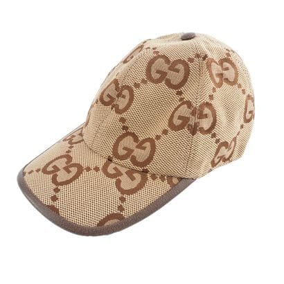 GUCCI
Casquette beige et marron monogrammée...