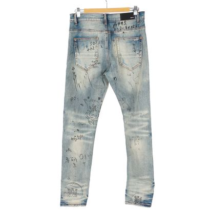 AMIRI 
Jean bleu coupe skinny en denim élastique....