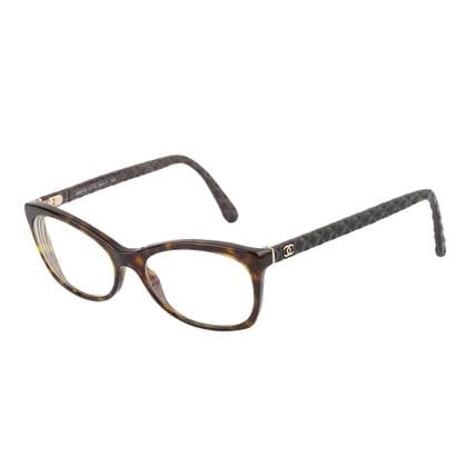 CHANEL
Montures à motif tortoise avec tempes...