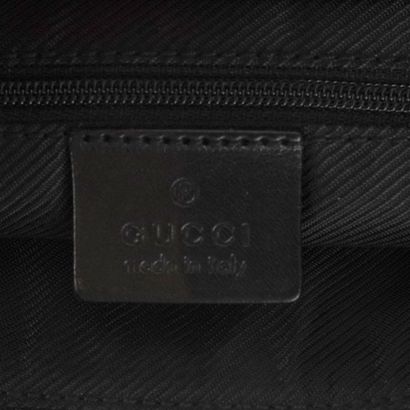 GUCCI
Messenger bag in black canvas and leather,...