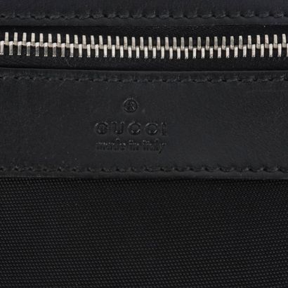 GUCCI
Gucci messenger bag in black canvas...