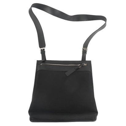 GUCCI
Gucci messenger bag in black canvas...