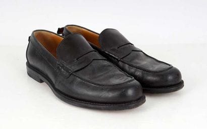 GUCCI
Black leather penny loafers. 
Men's...