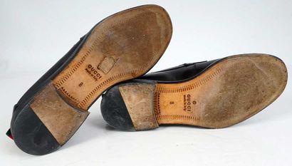 GUCCI
Black leather penny loafers. 
Men's...