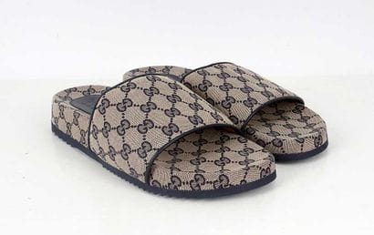 GUCCI
Beige monogrammed canvas sandals with...