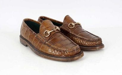 GUCCI 
Brown croco-style leather penny loafers...