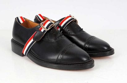 THOM BROWNE
Black leather lace-up brogue...