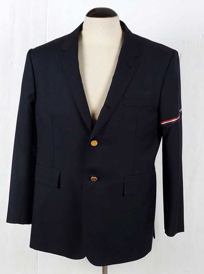 THOM BROWNE
Navy blue tailored jacket fastened...