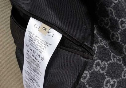 GUCCI
Charcoal gray wool blazer with GG monogram,...