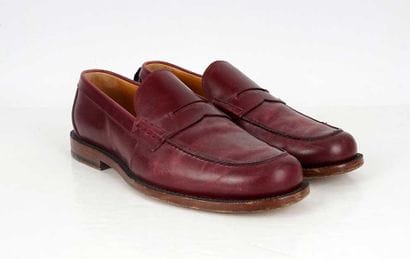 GUCCI
Burgundy leather penny loafers. 
Men's...