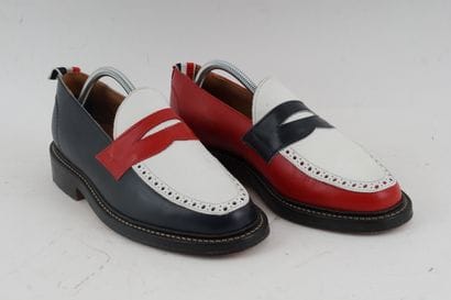 THOM BROWNE
Three-tone leather penny loafers...