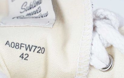 MIHARA YASUHIRO 
Off-white canvas sneakers...