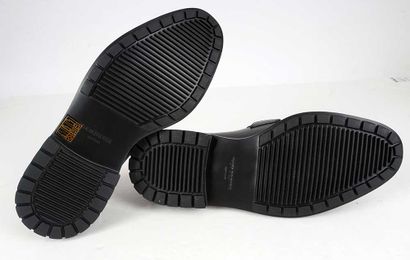 THOM BROWNE
Black leather loafers with perforated...