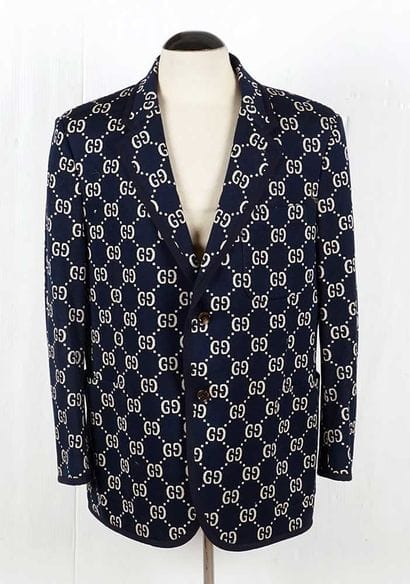 GUCCI 
Navy blue wool blazer trimmed with...