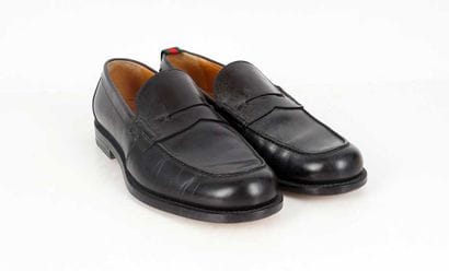 GUCCI
Black leather penny loafers.
Men's...